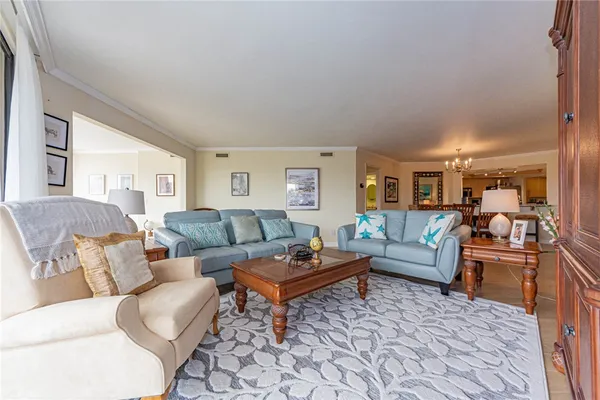 a living room with furniture and a rug