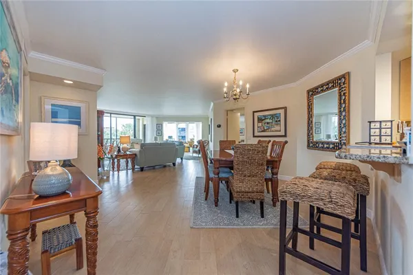 a dining room with furniture a livingroom and chandelier