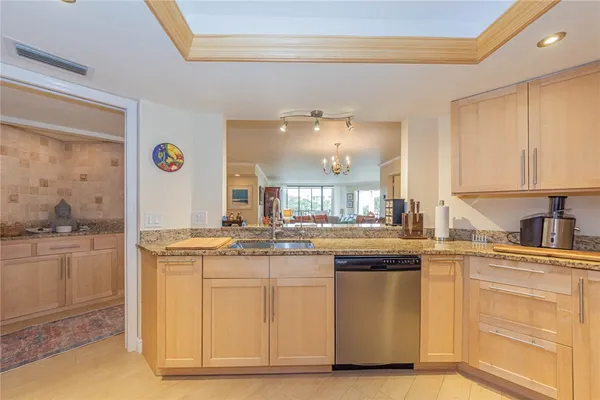 a kitchen with cabinets and window