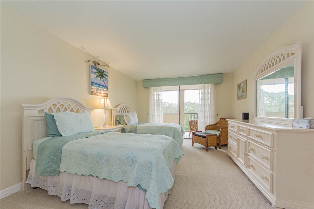 1850 Bay Road, Unit 3G Vero Beach, FL 32963 - Photo 28 of 36 a bed room with a bed and a large window