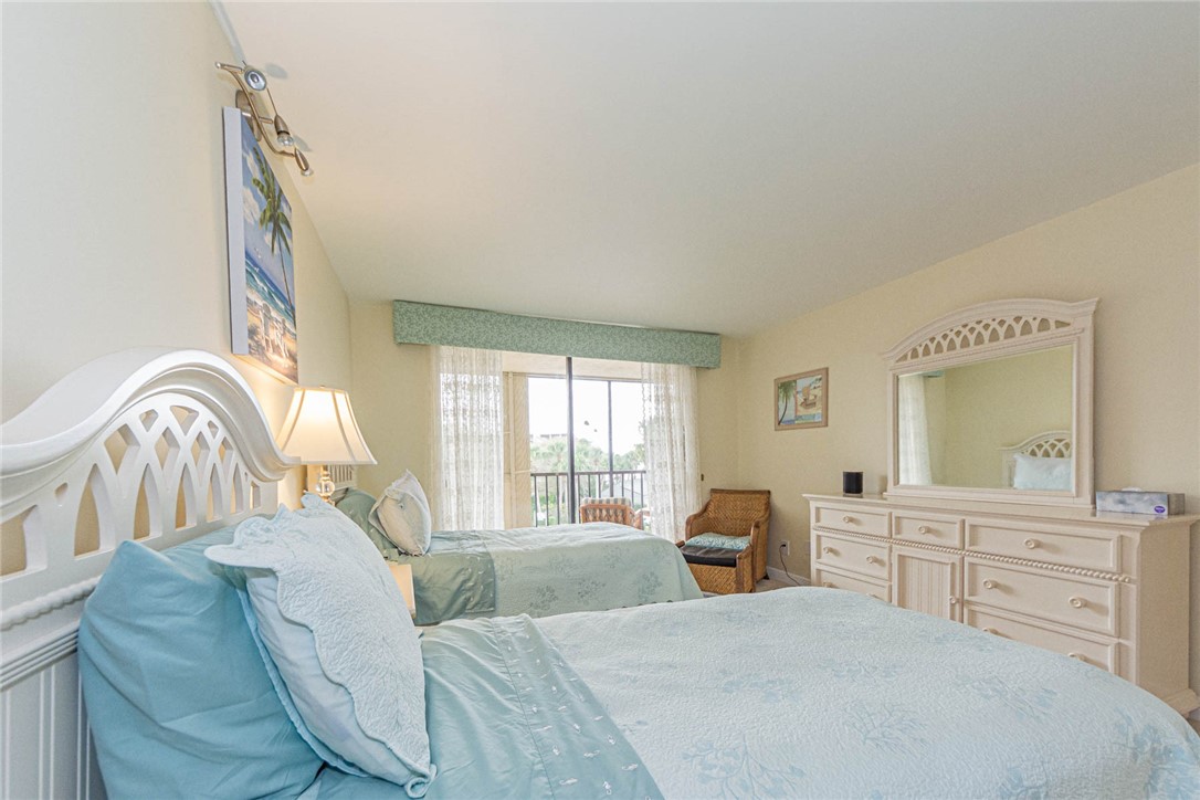 1850 Bay Road, Unit 3G Vero Beach, FL 32963 - Photo 29 of 36 a living room with furniture and a flat screen tv