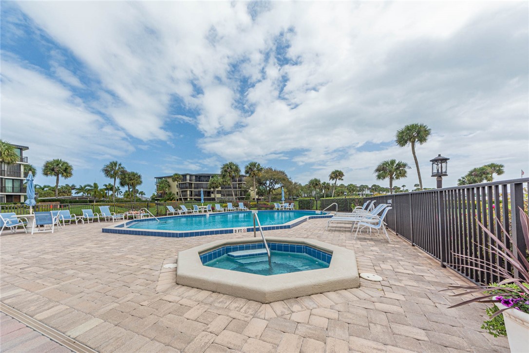 1850 Bay Road, Unit 3G Vero Beach, FL 32963 - Photo 34 of 36 a view of a lake with a yard