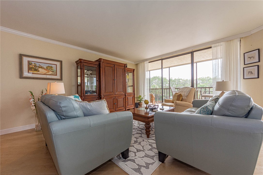1850 Bay Road, Unit 3G Vero Beach, FL 32963 - Photo 8 of 36 a living room with furniture and a large window