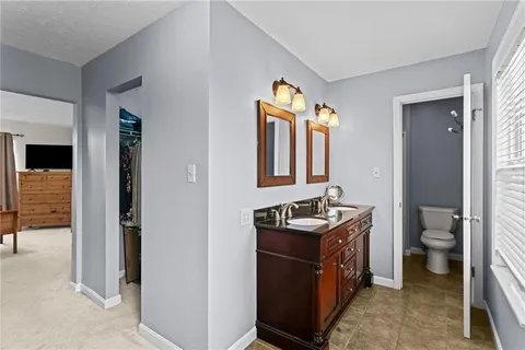 a white bath tub sitting next to a window