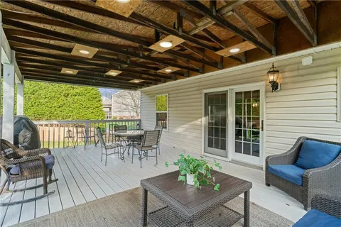 a view of a patio with wooden floor