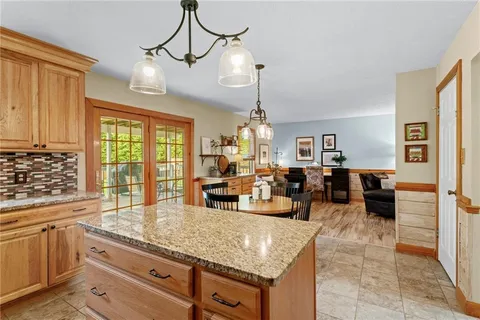 a kitchen with counter top space cabinets and appliances