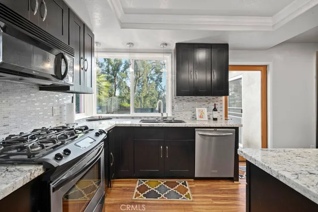 a kitchen with a stove and a sink