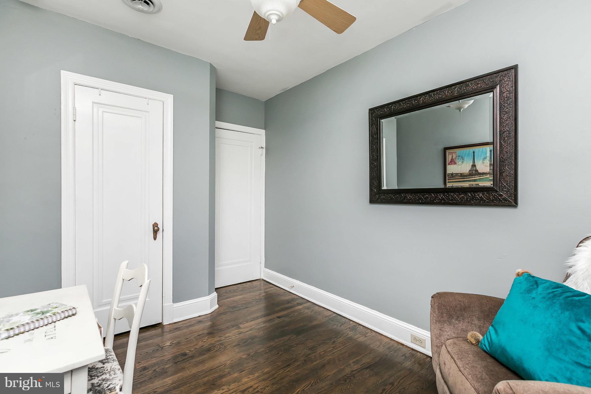 419 Hopkins Road Baltimore, MD 21212 - Photo 21 of 30 a living room with a couch and a wooden floor