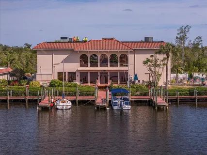 an aerial view of a house with a ocean view