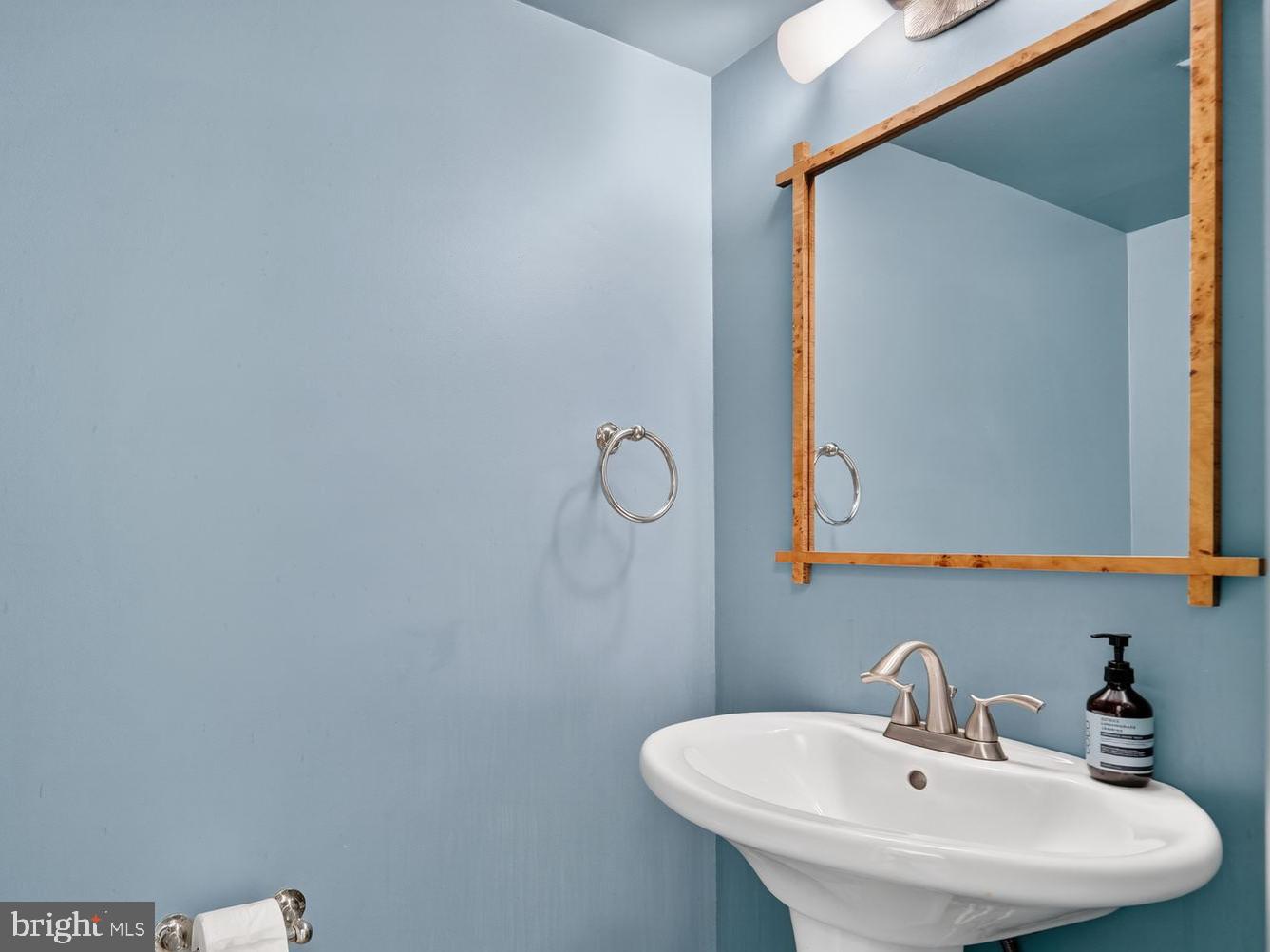 11201 Wedge Drive Reston, VA 20190 - Photo 13 of 31 a bathroom with a sink and mirror