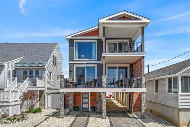 a view of multiple houses with a deck