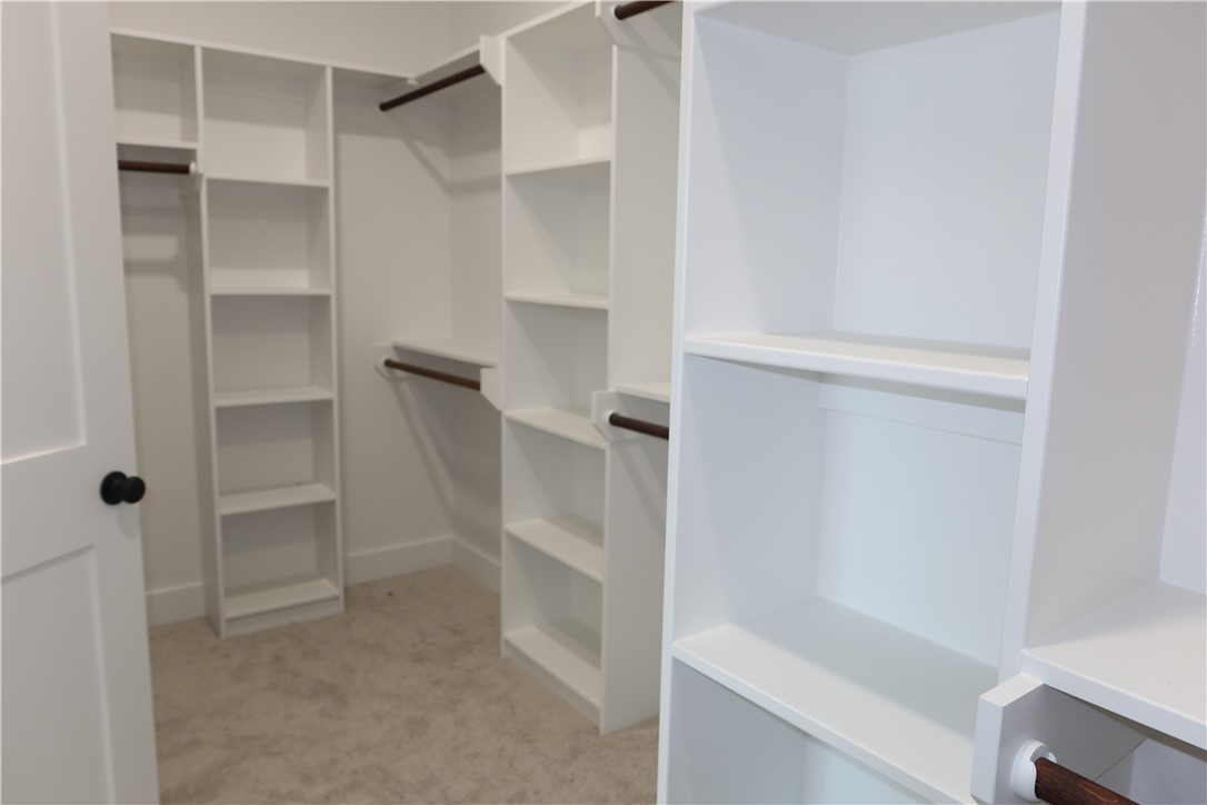 2014 Reagan Court Bryan, TX 77802 - Photo 13 of 22 a bathroom with a walk in closet