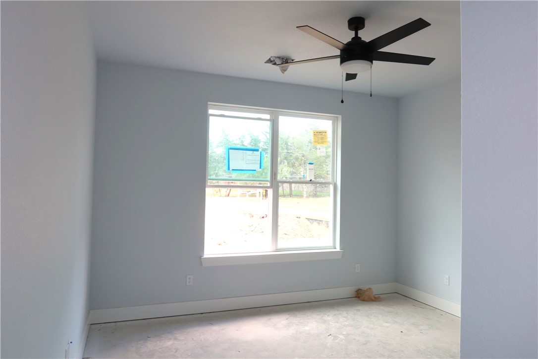 2014 Reagan Court Bryan, TX 77802 - Photo 15 of 23 an empty room with a window and a fan
