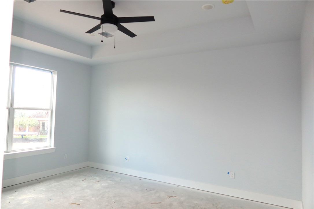 2014 Reagan Court Bryan, TX 77802 - Photo 16 of 23 an empty room with a window and a fan