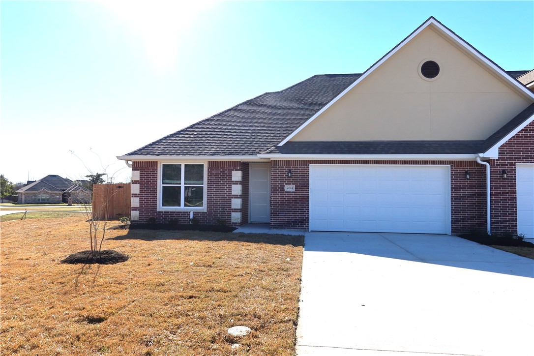 2014 Reagan Court Bryan, TX 77802 - Photo 2 of 22 a front view of a house with a yard
