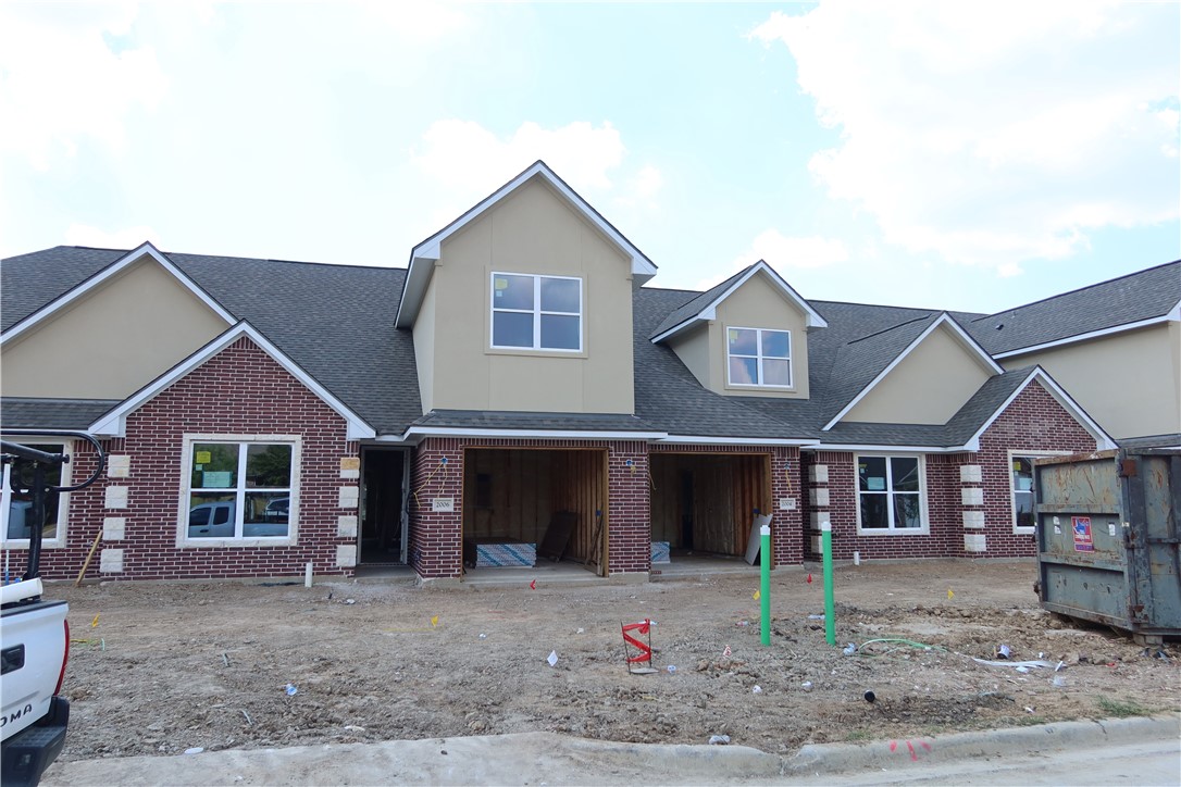 2014 Reagan Court Bryan, TX 77802 - Photo 3 of 23 a front view of a house with a yard