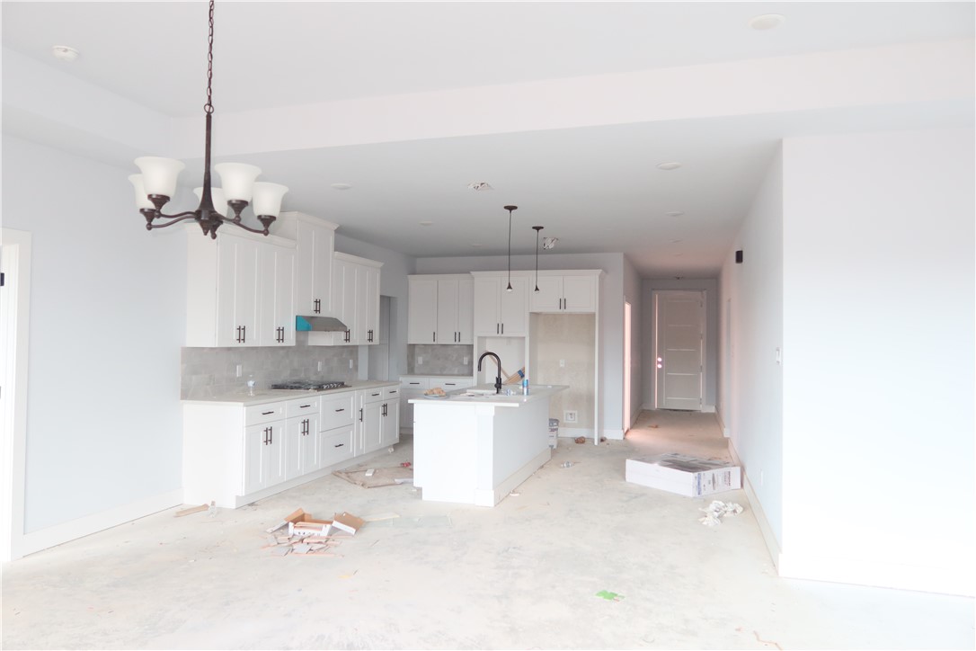 2014 Reagan Court Bryan, TX 77802 - Photo 5 of 23 a large white kitchen with cabinets