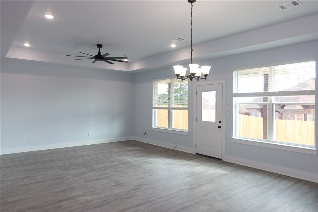 2014 Reagan Court Bryan, TX 77802 - Photo 9 of 22 a view of an empty room with a window and wooden floor