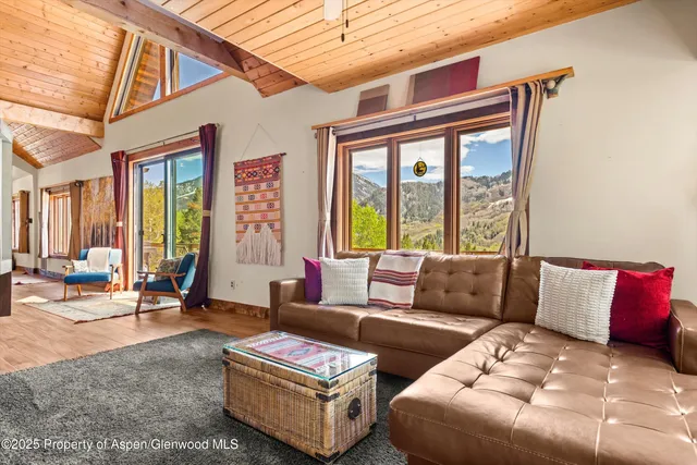 a bedroom with two beds and a potted plant