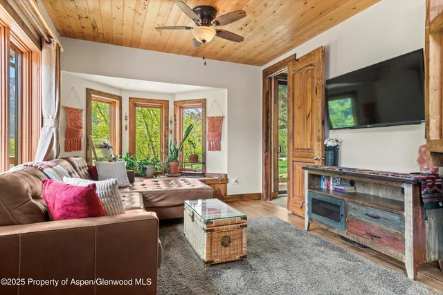 a bedroom with two beds and a window