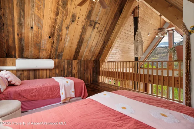 a view of a storage and utility room with washer and dryer