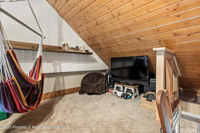 a view of front door with hallway and a living room