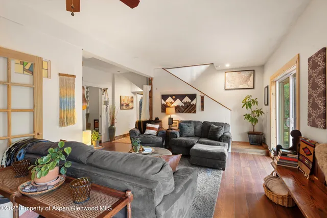 a view of balcony with wooden floor and fence