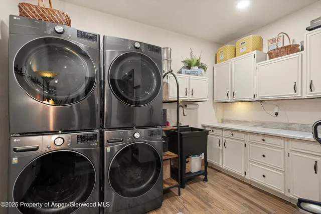 a living room with lots of furniture and a chandelier