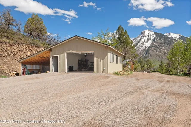 a view of a floor to ceiling window and a yard