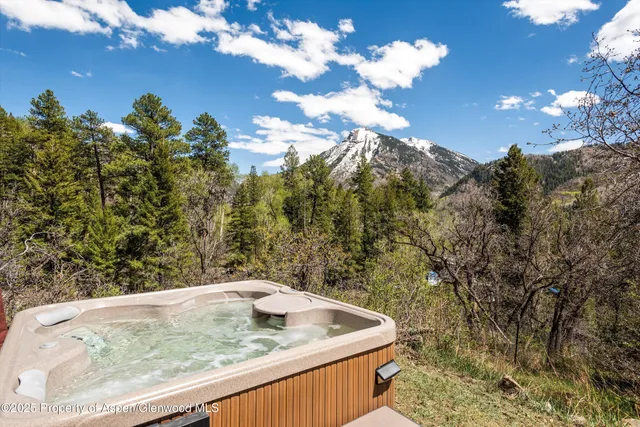 a kitchen with stainless steel appliances granite countertop a stove a sink dishwasher and a refrigerator