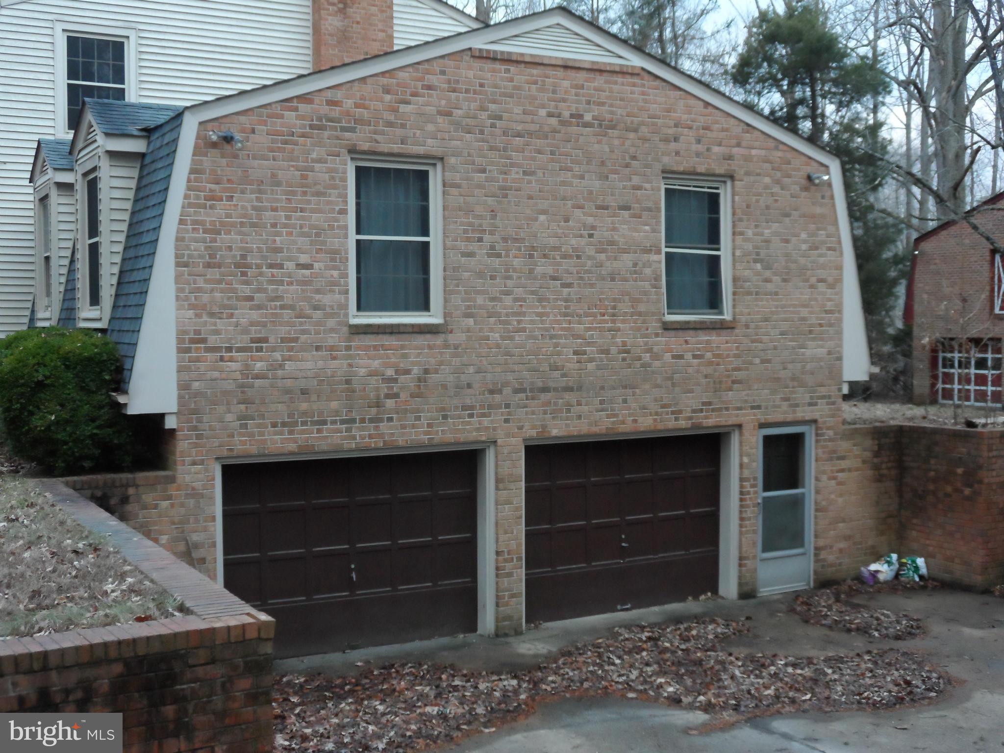 11291 Dahlgren Road King George, VA 22485 - Photo 5 of 23 Side view of home showing 2 car garage
