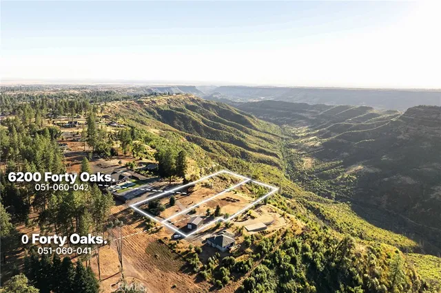 an aerial view of residential house with parking space
