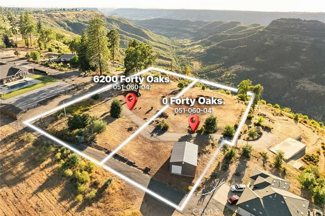 a front view of a house with a yard garage and a chair