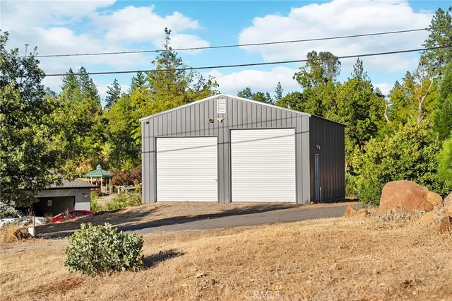 a view of a yard with an ocean view