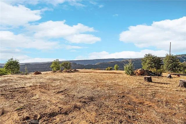 a view of a ocean beach and city