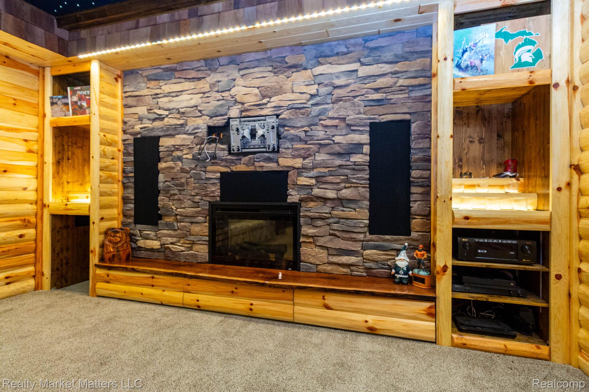 770 North Fairgrounds Road Imlay City, MI 48444 - Photo 37 of 55 Stone veneer accent wall with an electric fireplace