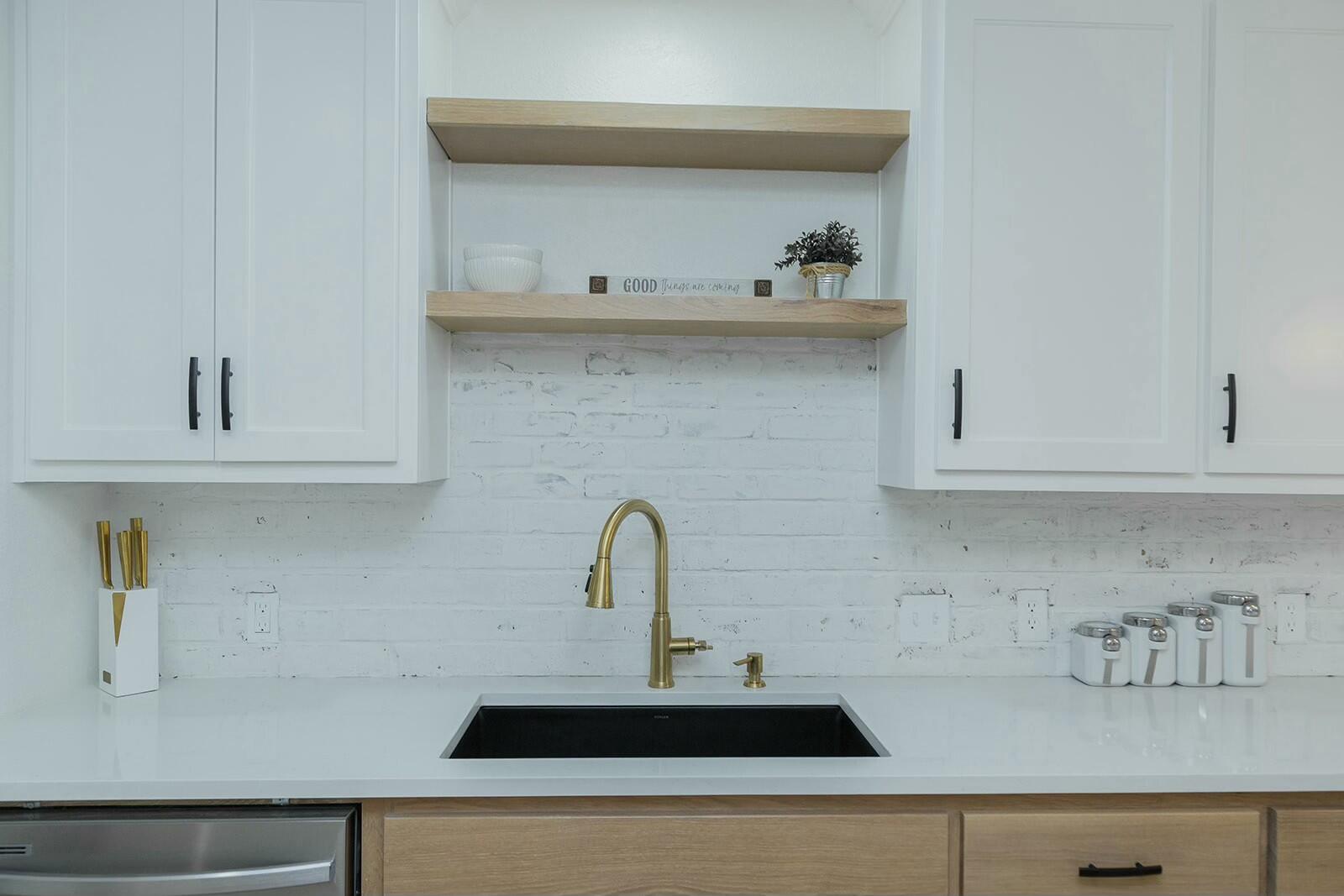2802 West 20th Plainview, TX 79072 - Photo 11 of 50 a kitchen with a sink and cabinets