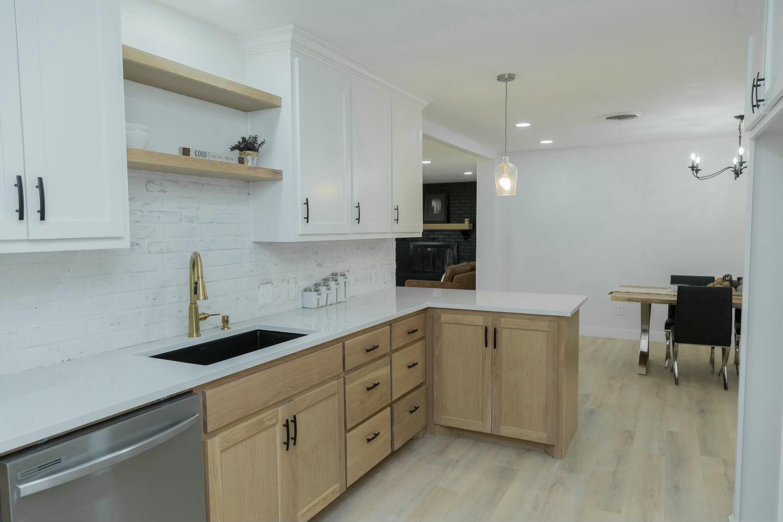 2802 West 20th Plainview, TX 79072 - Photo 13 of 50 a kitchen with sink cabinets and chair