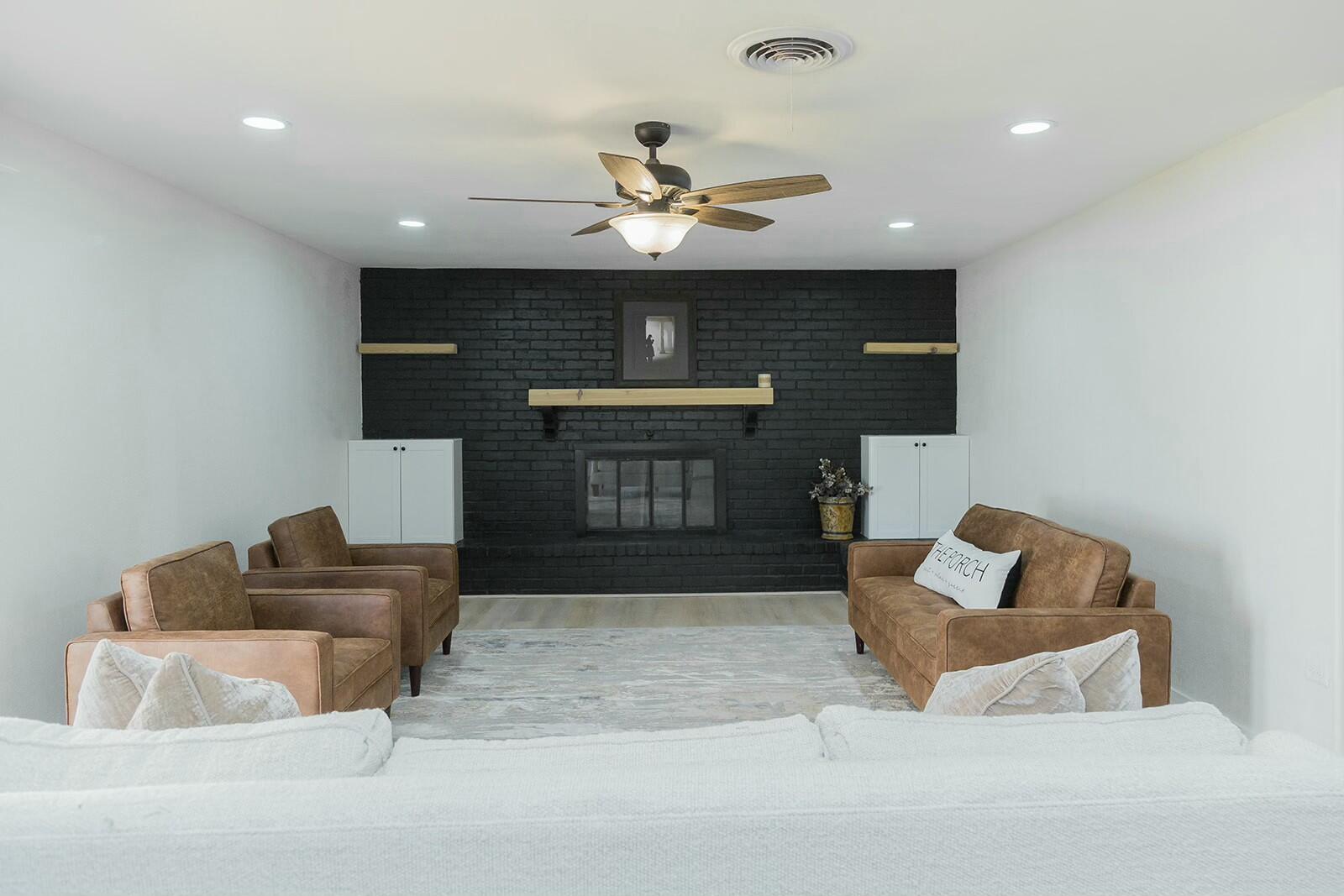 2802 West 20th Plainview, TX 79072 - Photo 16 of 50 a living room with furniture and a fireplace