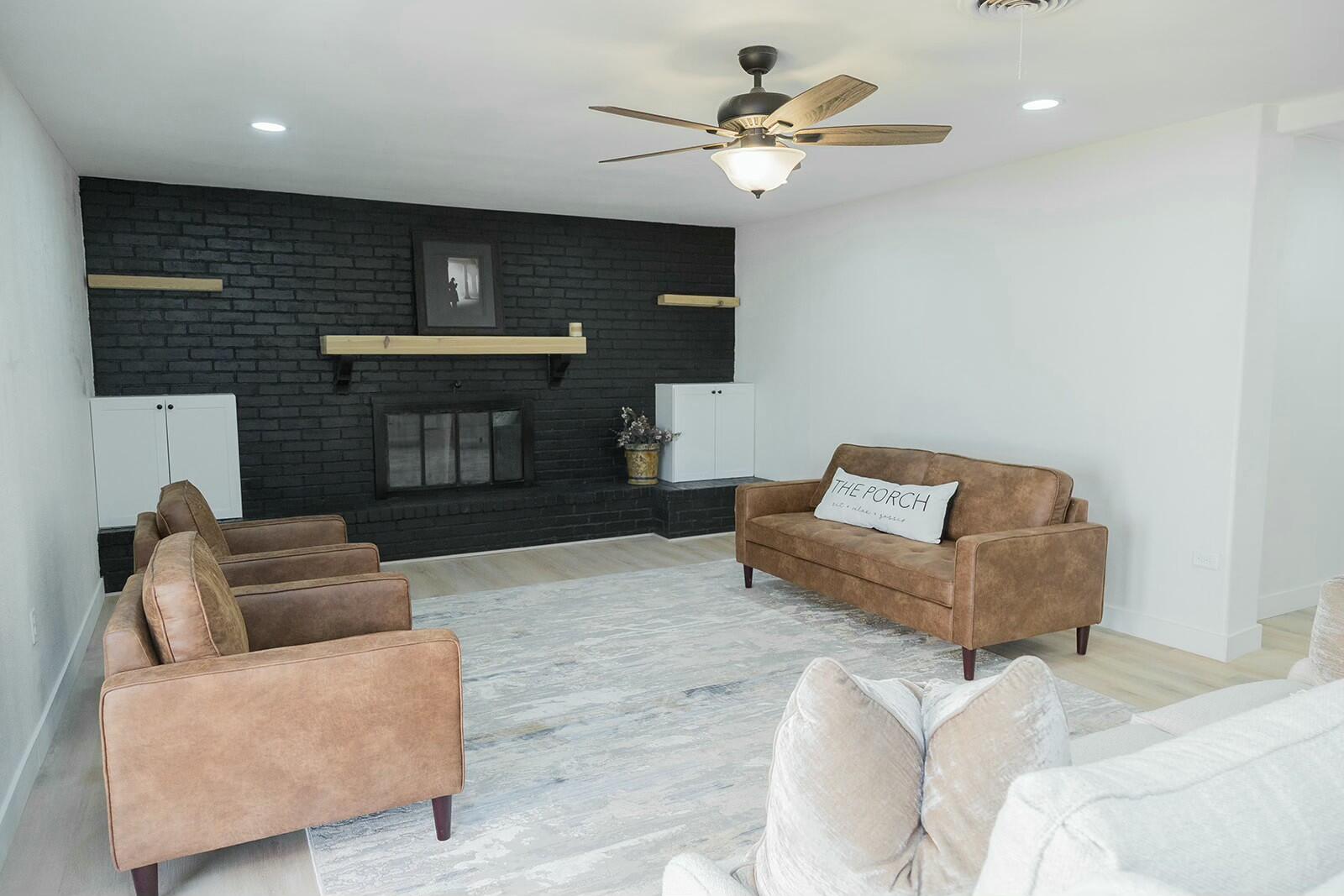 2802 West 20th Plainview, TX 79072 - Photo 17 of 50 a living room with furniture and a fireplace
