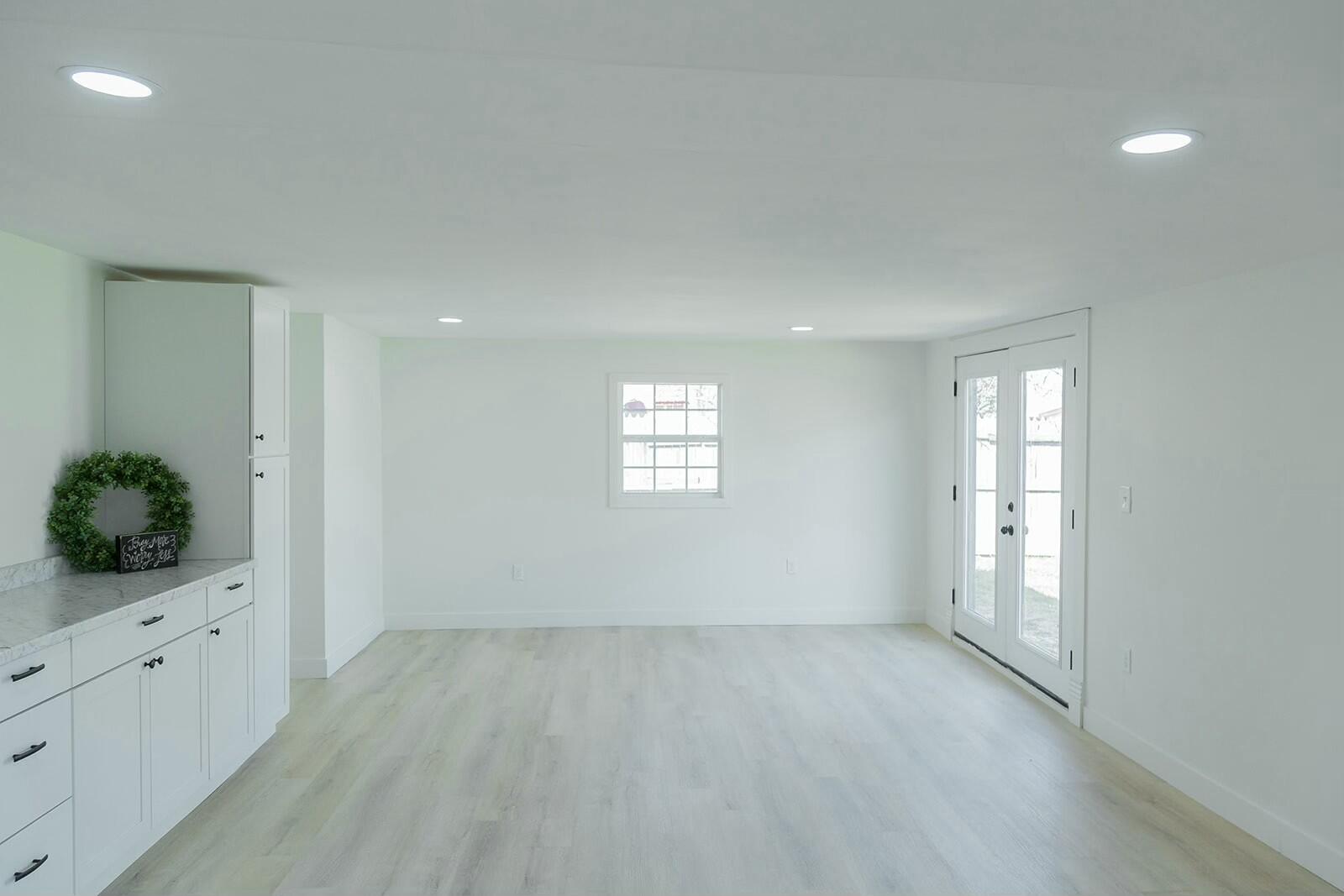 2802 West 20th Plainview, TX 79072 - Photo 22 of 50 an empty room with windows and cabinet