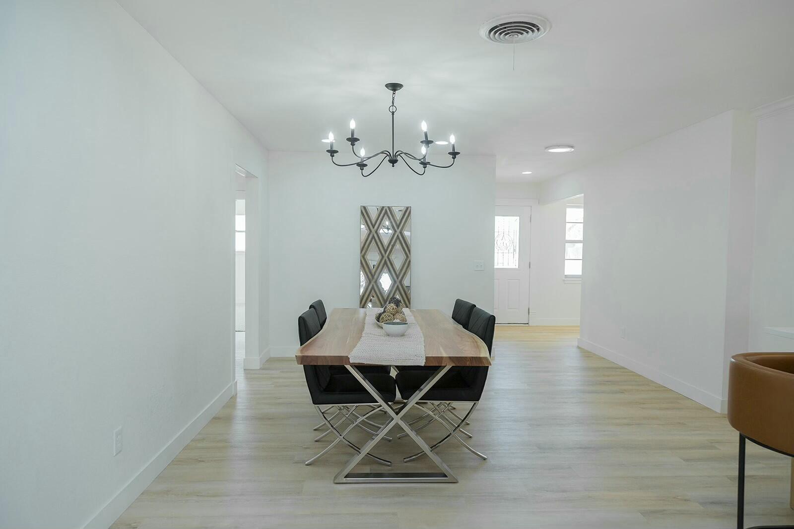 2802 West 20th Plainview, TX 79072 - Photo 8 of 50 a view of a dining room with furniture and chandelier