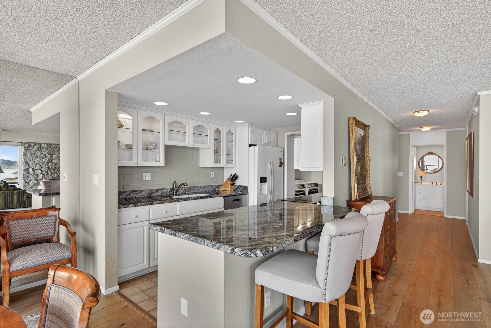 610 Front Street, Unit 302 Mukilteo, WA 98275 - Photo 15 of 40 a large kitchen with a table and chairs