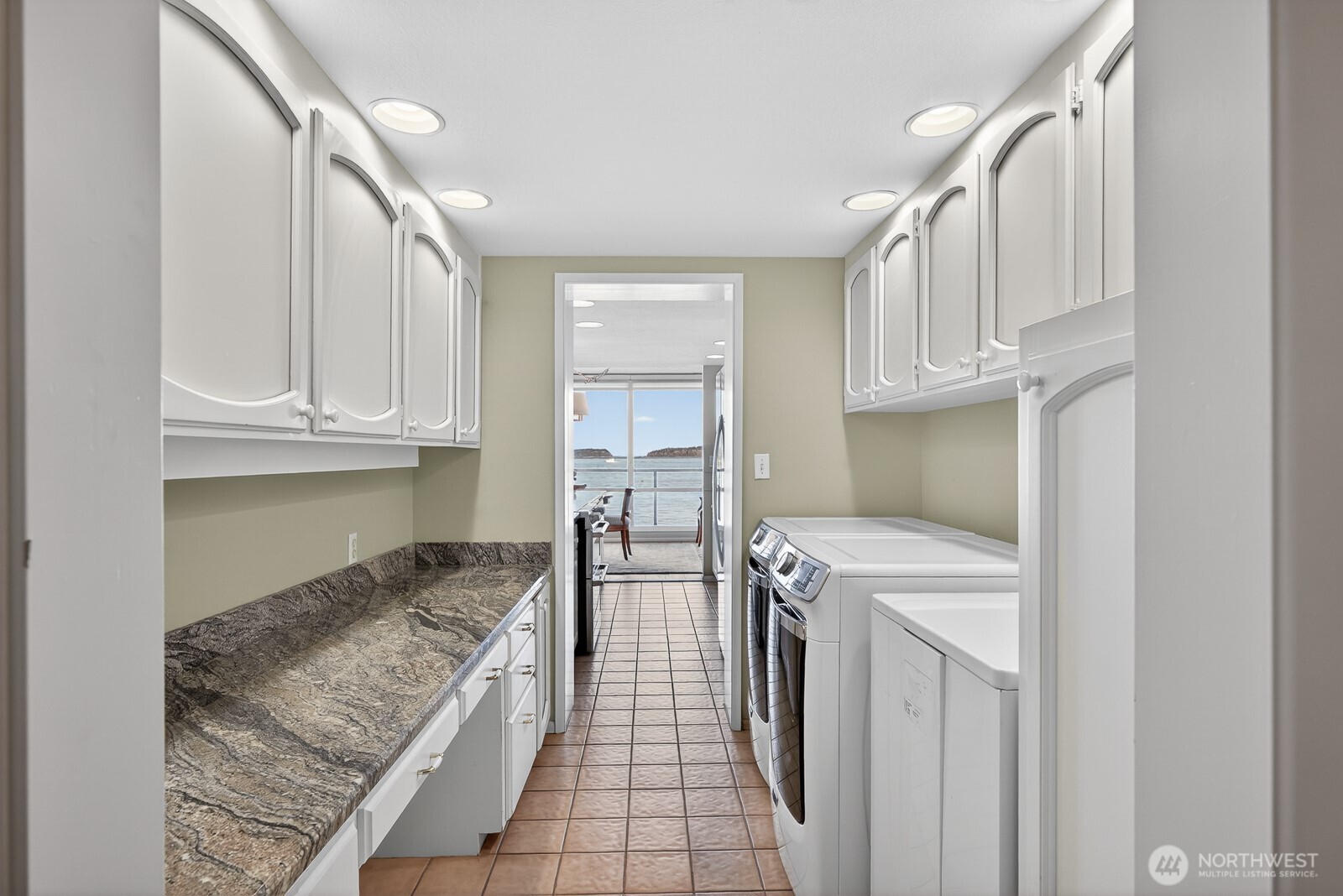 610 Front Street, Unit 302 Mukilteo, WA 98275 - Photo 28 of 40 a kitchen with white cabinets and sink
