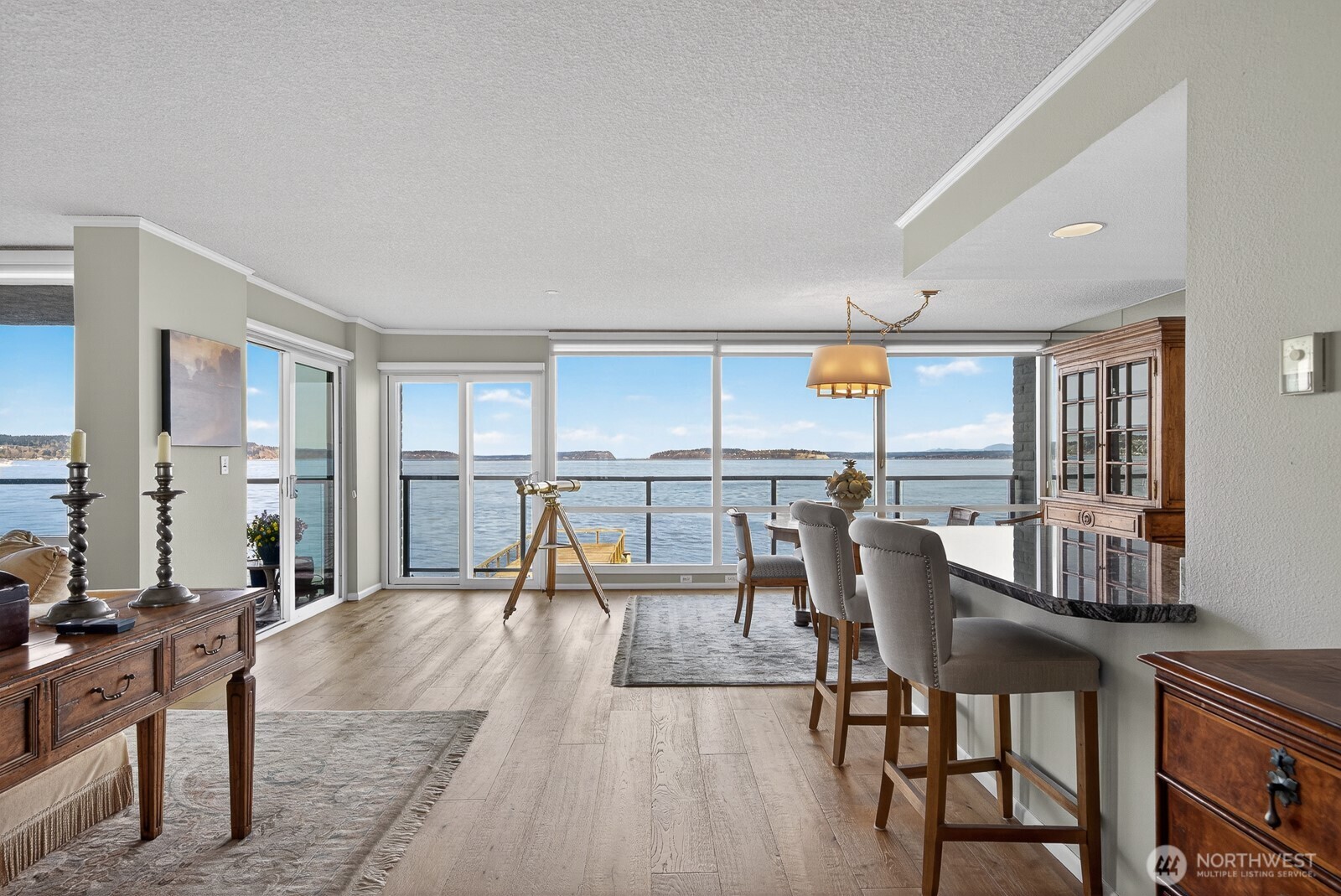 610 Front Street, Unit 302 Mukilteo, WA 98275 - Photo 7 of 40 a dining room with furniture and wooden floor