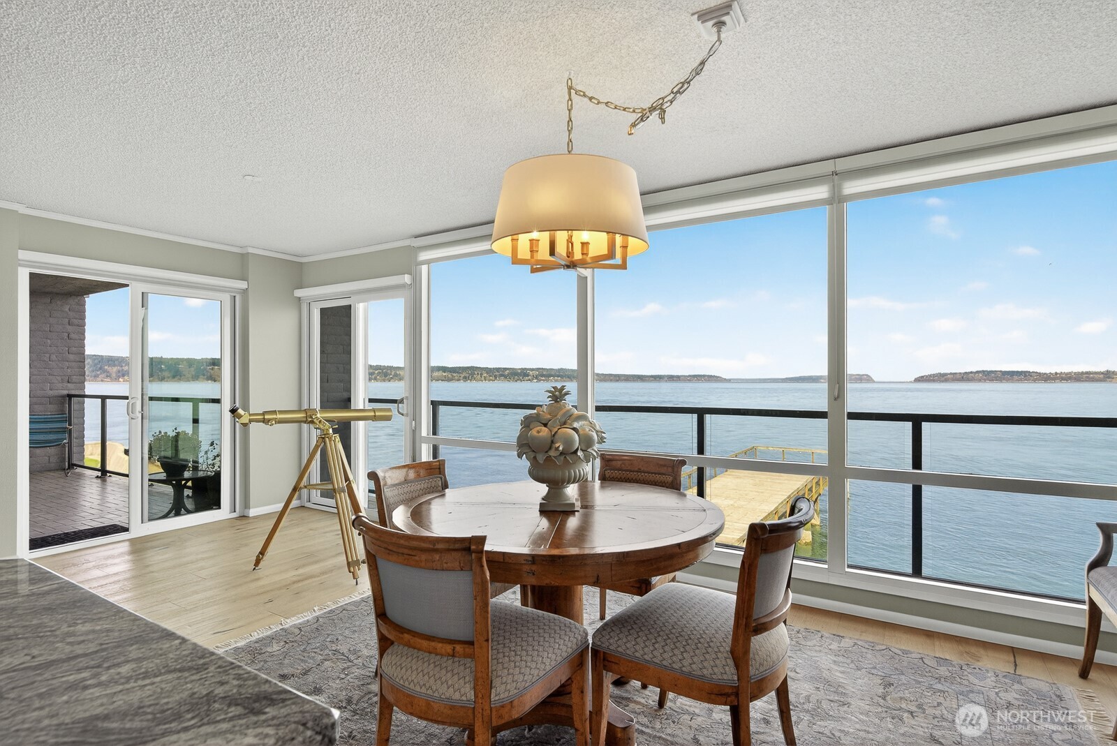 610 Front Street, Unit 302 Mukilteo, WA 98275 - Photo 10 of 40 a dining room with furniture and wooden floor