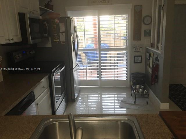 6783 Bridlewood Court, Unit 6783 Boca Raton, FL 33433 - Photo 12 of 56 a view of kitchen with a window