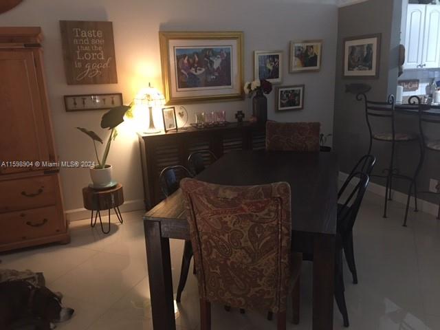 6783 Bridlewood Court, Unit 6783 Boca Raton, FL 33433 - Photo 18 of 56 a dining room with furniture and window