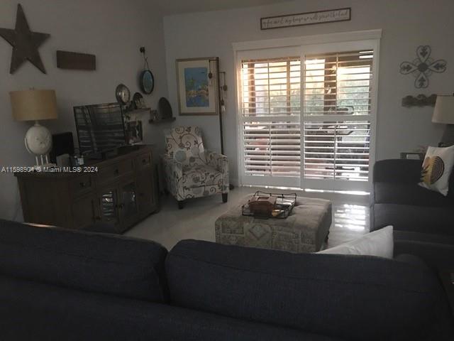 6783 Bridlewood Court, Unit 6783 Boca Raton, FL 33433 - Photo 20 of 56 a living room with furniture and a window