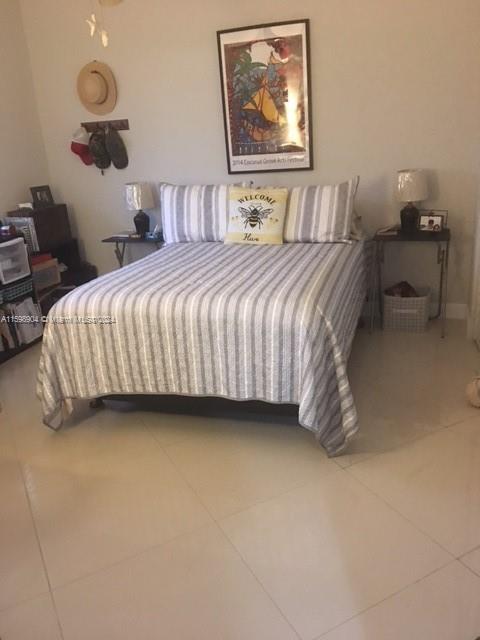 6783 Bridlewood Court, Unit 6783 Boca Raton, FL 33433 - Photo 23 of 56 a bedroom with a bed and window